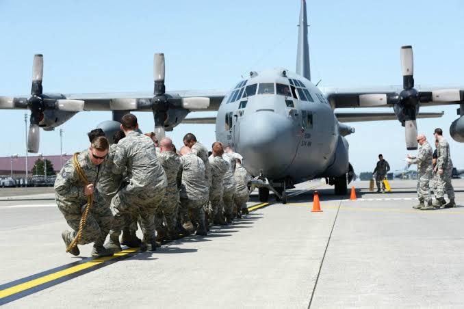 Soldiers Pulling Plane